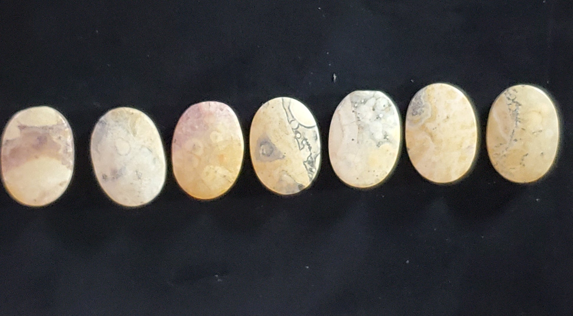 Sky Eye Jasper Oval stones in creams, browns, reds, with gray marbling