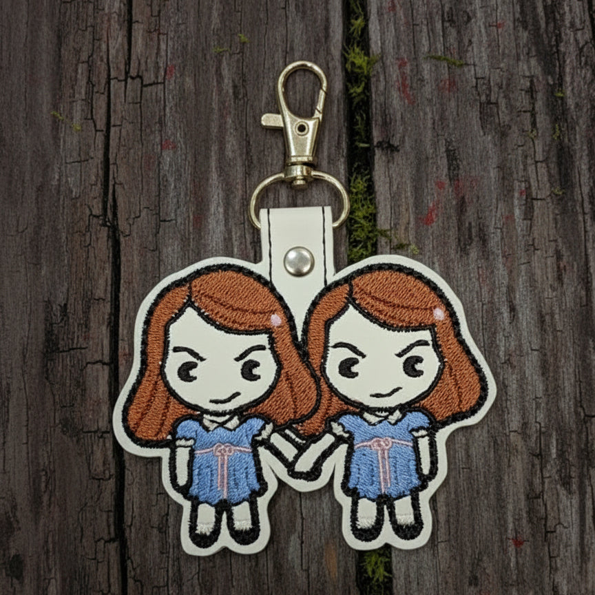 Keychain with cartoon characters on a wooden background