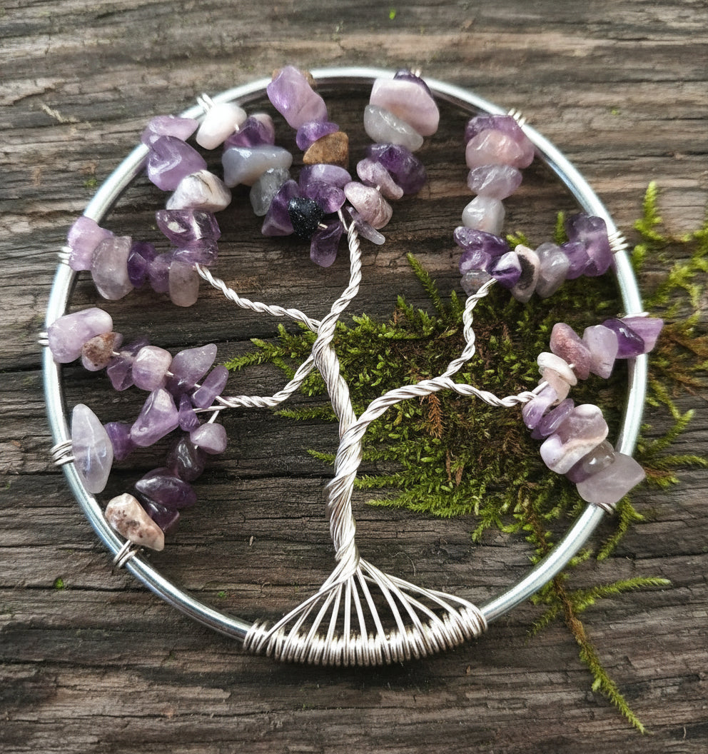 A silver ring-shaped suncatcher with Amethyst chips and tarnish-resistant silver wire.